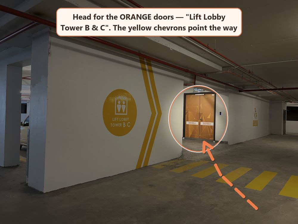 Orange doors of the parking lift lobby for Towers B and C