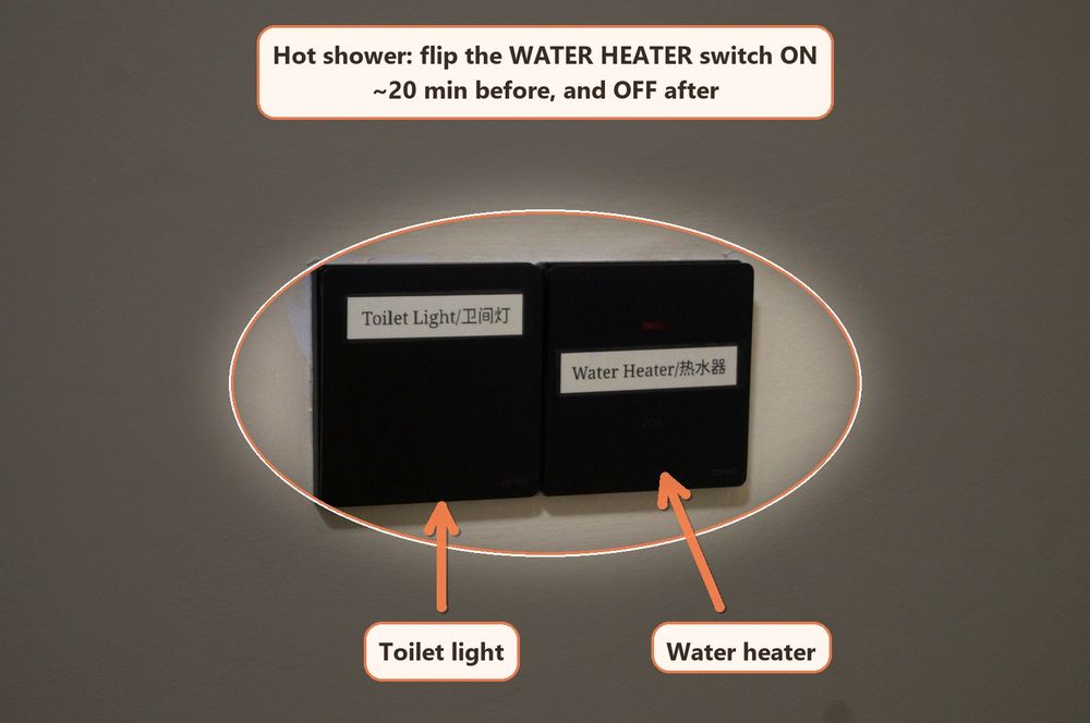 Bathroom wall switches with the water heater switch labelled