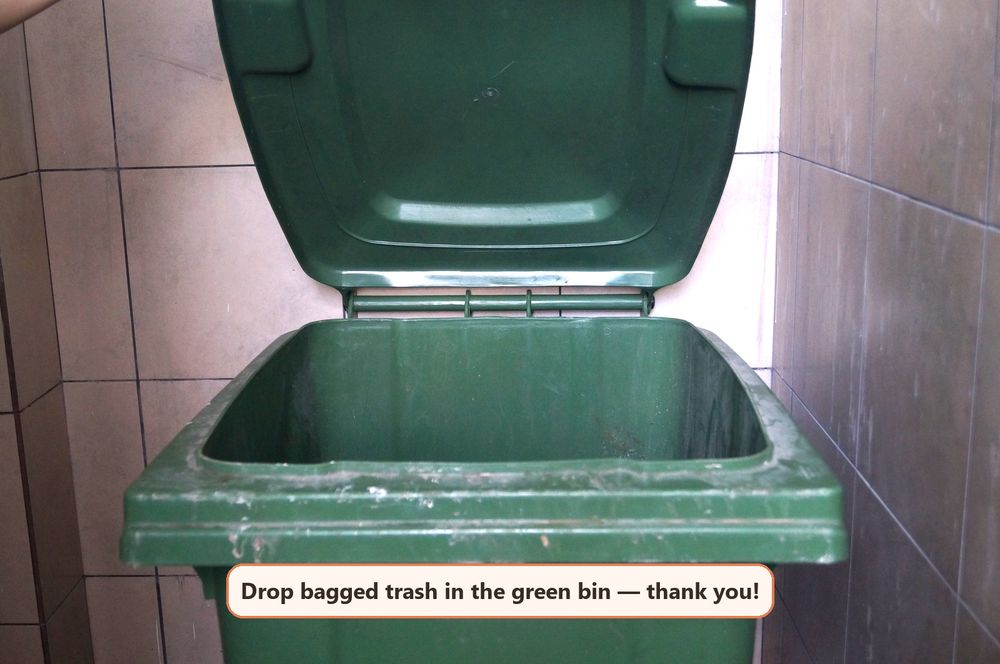 Green bin inside the refuse chamber